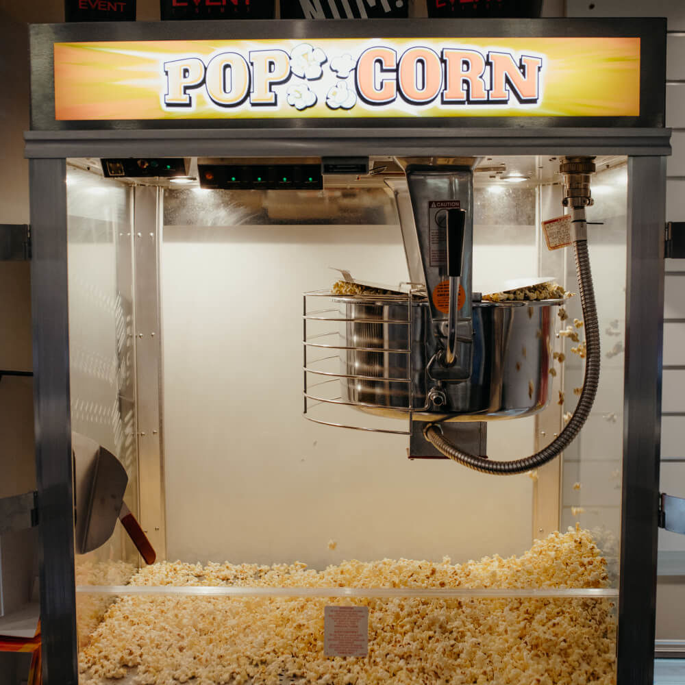 Picture of a popcorn machine with popcorn inside