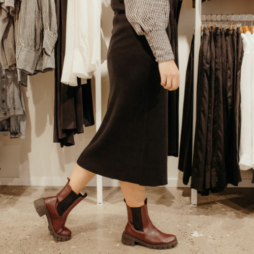 Picture of woman wearing a skirt and boots