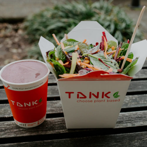 Picture of a tank salad with a berry smoothie